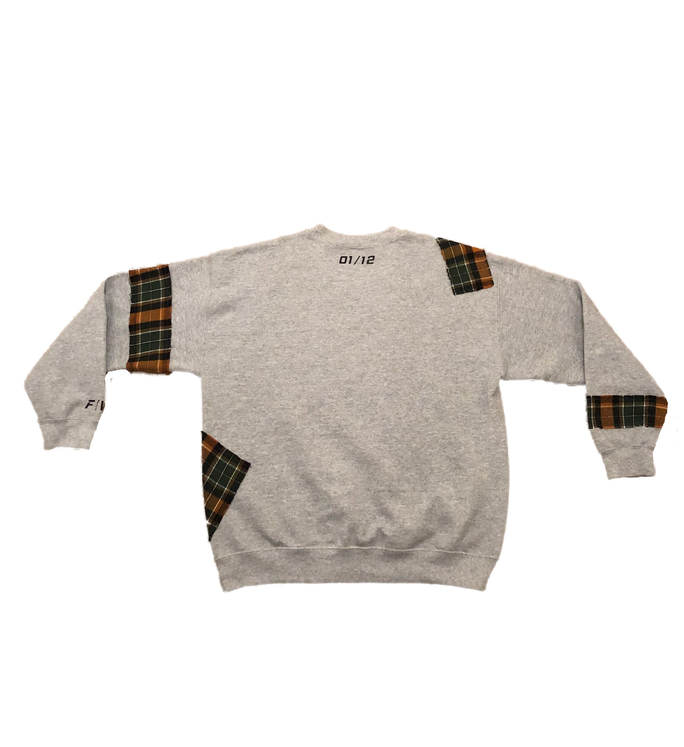 Gray sweatshirt with plaid patchwork accents on sleeves